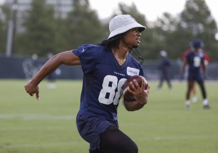 Jun 15, 2022; Houston, TX, USA; Houston Texans wide receiver John Metchie III (88) runs with the ball during minicamp at Houston Methodist Training Center. Mandatory Credit: Troy Taormina-USA TODAY Sports