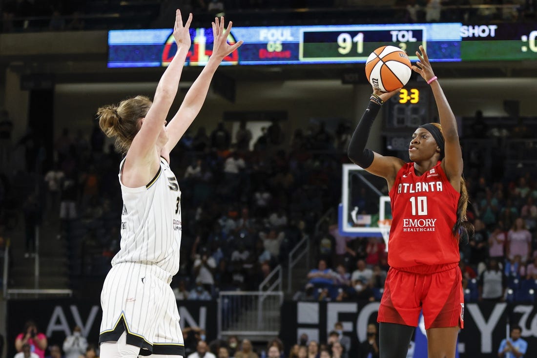 Jun 17, 2022; Chicago, Illinois, USA; Atlanta Dream guard Rhyne Howard (10) shoots against Chicago Sky forward Emma Meesseman (33) during the second half of a WNBA game at Wintrust Arena. Mandatory Credit: Kamil Krzaczynski-USA TODAY Sports