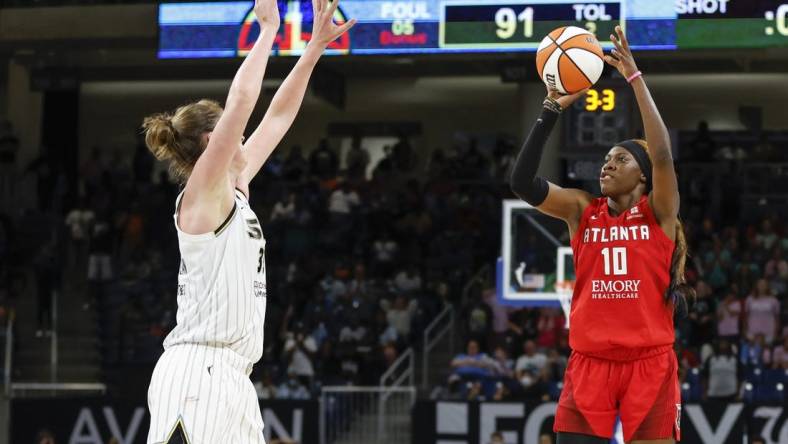 Jun 17, 2022; Chicago, Illinois, USA; Atlanta Dream guard Rhyne Howard (10) shoots against Chicago Sky forward Emma Meesseman (33) during the second half of a WNBA game at Wintrust Arena. Mandatory Credit: Kamil Krzaczynski-USA TODAY Sports