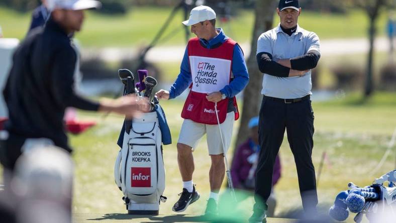 Brooks Koepka watches Matthew Wolff putt on the 4th hole during the second round of the Honda Classic at PGA National in Palm Beach Gardens, Feb. 28, 2020.

Brooks Koepka 22