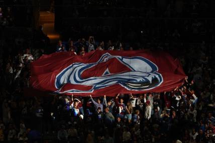 Jun 24, 2022; Denver, Colorado, USA; Colorado Avalanche fans raise a logo banner before game five of the 2022 Stanley Cup Final against the Tampa Bay Lightning at Ball Arena. Mandatory Credit: Mark J. Rebilas-USA TODAY Sports