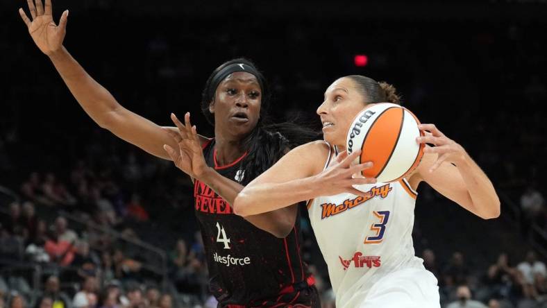 Jun 29, 2022; Phoenix, Arizona, USA; Phoenix Mercury guard Diana Taurasi (3) drives against Indiana Fever center Queen Egbo (4) during the first half at Footprint Center. Mandatory Credit: Joe Camporeale-USA TODAY Sports