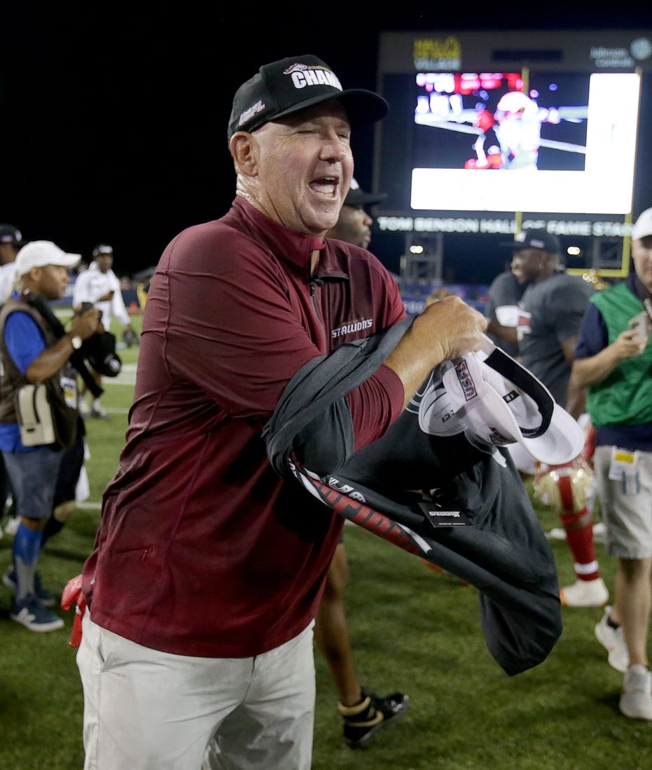 The Birmingham Stallions head coach Skip Holtz changes into a USFL champions t-shirt during as he and his team celebrate their USFL championship after beating the Philadelphia Stars at Tom Benson Hall of Fame Stadium in Canton Sunday, July 3, 2022.

Usfl Championship Game0562