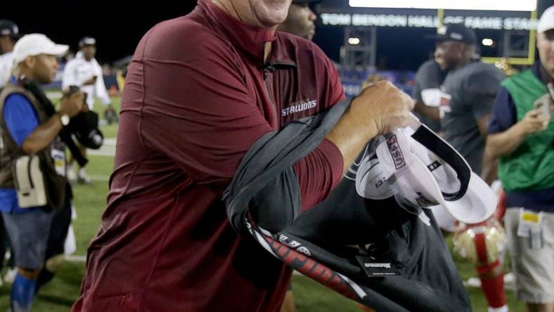 The Birmingham Stallions head coach Skip Holtz changes into a USFL champions t-shirt during as he and his team celebrate their USFL championship after beating the Philadelphia Stars at Tom Benson Hall of Fame Stadium in Canton Sunday, July 3, 2022.

Usfl Championship Game0562