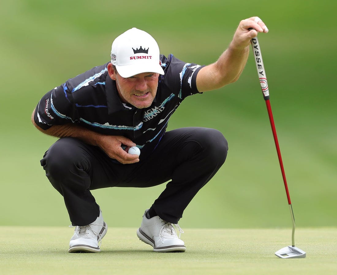 Alex Cejka reads the green on the 1st hole during second round of the Bridgestone Senior Players Tournament at Firestone Country Club on Friday.

Bridgestonejl 2