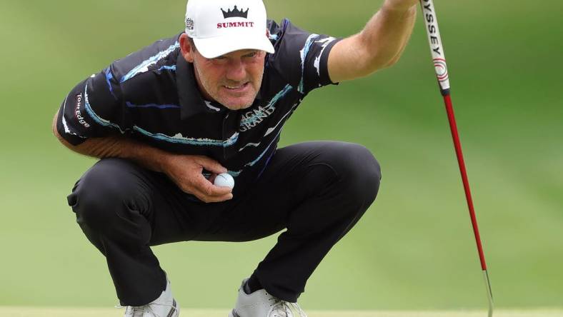 Alex Cejka reads the green on the 1st hole during second round of the Bridgestone Senior Players Tournament at Firestone Country Club on Friday.

Bridgestonejl 2