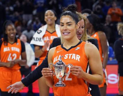 Jul 10, 2022; Chicago, Ill, USA; WNBA Commissioner Cathy Engelbert presents the WNBA All Star Game MVP Award to Team Wilson guard Kelsey Plum at Wintrust Arena. Mandatory Credit: David Banks-USA TODAY Sports