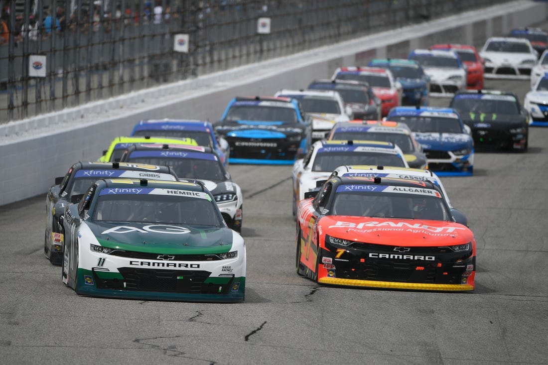 Jul 16, 2022; Loudon, New Hampshire, USA; NASCAR Xfinity Series driver Daniel Hemric (11) and driver Justin Allgaier (7) race during the Crayon 200 at New Hampshire Motor Speedway. Mandatory Credit: Eric Canha-USA TODAY Sports