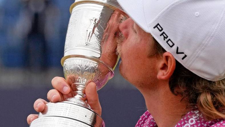 Jul 17, 2022; St. Andrews, SCT; Cameron Smith kisses the claret jug after winning the 150th Open Championship golf tournament at St. Andrews Old Course. Mandatory Credit: Michael Madrid-USA TODAY Sports