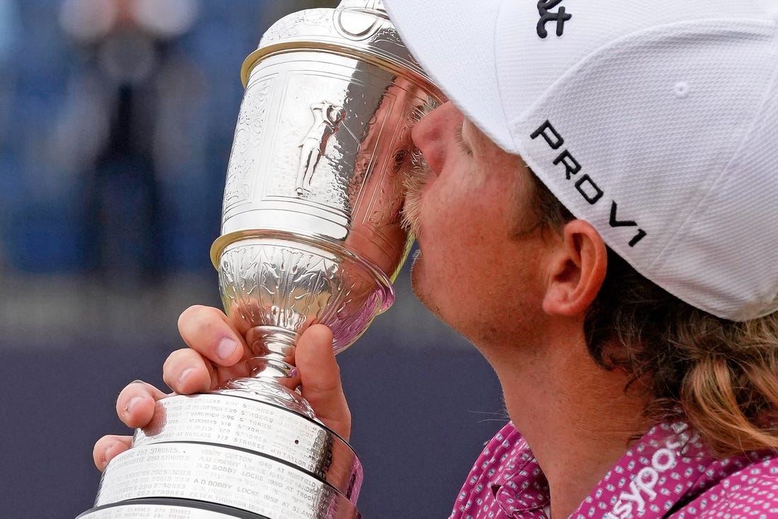 Jul 17, 2022; St. Andrews, SCT; Cameron Smith kisses the claret jug after winning the 150th Open Championship golf tournament at St. Andrews Old Course. Mandatory Credit: Michael Madrid-USA TODAY Sports