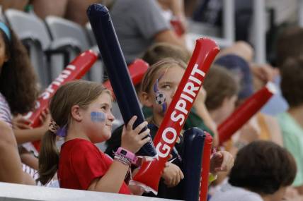 Jul 17, 2022; Washington, District of Columbia, USA; A young Washington Spirit fan cheers from the stand during the second half against Orlando Pride at Audi Field. Mandatory Credit: Geoff Burke-USA TODAY Sports
