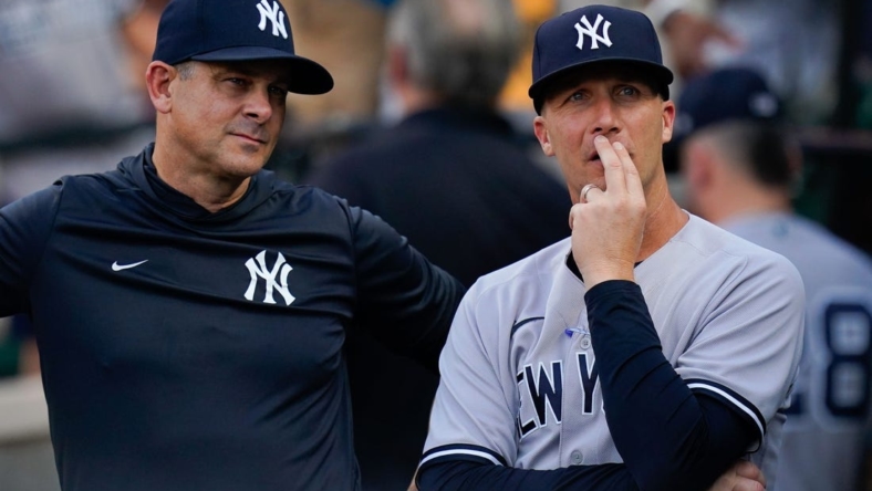 Jul 22, 2022; Baltimore, Maryland, USA; New York Yankees hitting coach Dillon Lawson (74) stands with manager Aaron Boone (17)  before the game against the Baltimore Orioles at Oriole Park at Camden Yards. Mandatory Credit: Tommy Gilligan-USA TODAY Sports