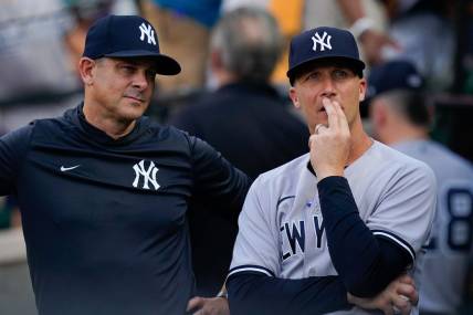 Jul 22, 2022; Baltimore, Maryland, USA; New York Yankees hitting coach Dillon Lawson (74) stands with manager Aaron Boone (17)  before the game against the Baltimore Orioles at Oriole Park at Camden Yards. Mandatory Credit: Tommy Gilligan-USA TODAY Sports