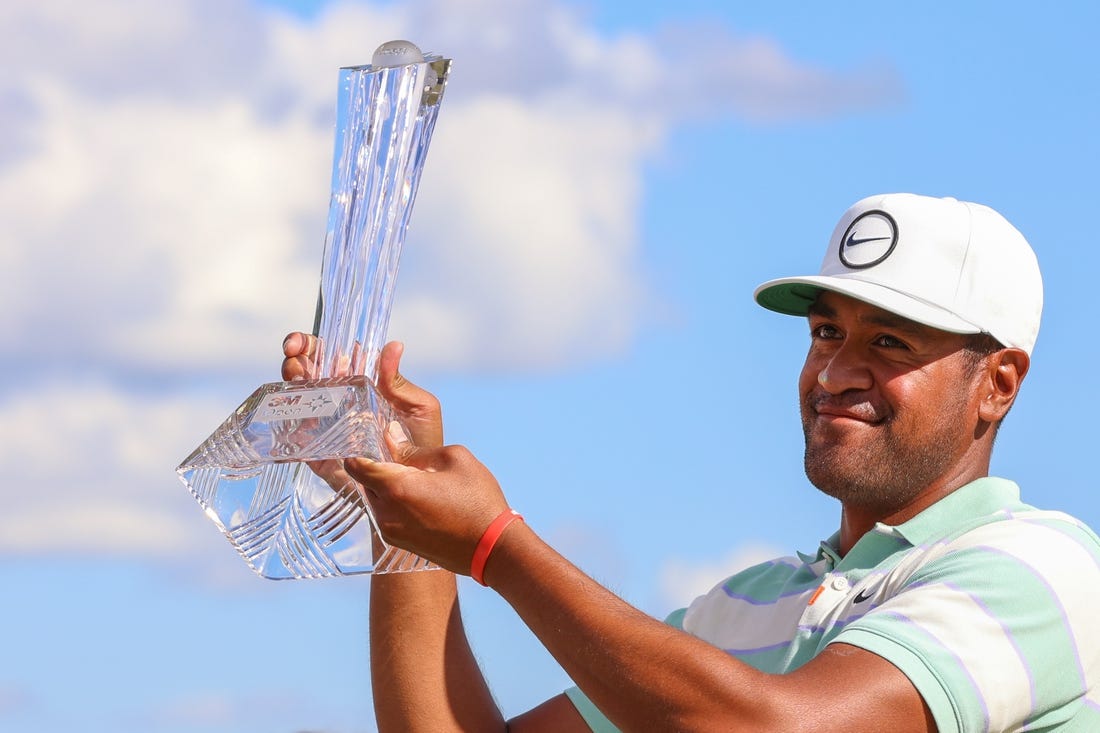 Jul 24, 2022; Blaine, Minnesota, USA; Tony Finau poses with the trophy after winning the 3M Open golf tournament. Mandatory Credit: Matt Krohn-USA TODAY Sports