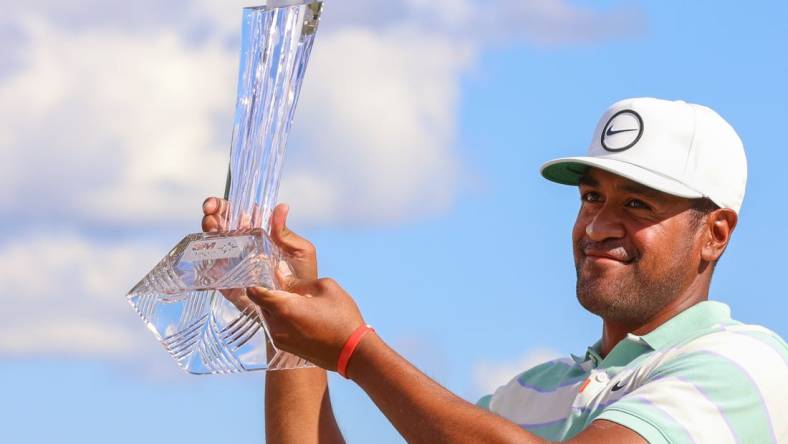 Jul 24, 2022; Blaine, Minnesota, USA; Tony Finau poses with the trophy after winning the 3M Open golf tournament. Mandatory Credit: Matt Krohn-USA TODAY Sports