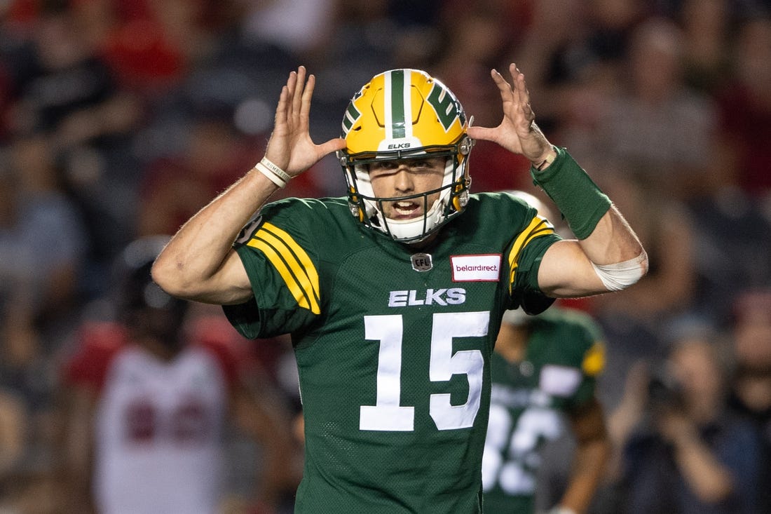 Aug 19, 2022; Ottawa, Ontario, CAN; Edmonton Elks quarterback Taylor Cornelius (15) calls a play in the second half against the Ottawa REDBLACKS at the TD Place stadium. Mandatory Credit: Marc DesRosiers-USA TODAY Sports