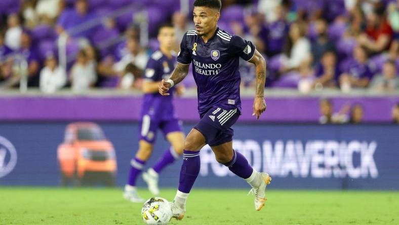 Sep 17, 2022; Orlando, Florida, USA;  Orlando City midfielder Junior Urso (11) controls the ball against Toronto FC in the second half at Exploria Stadium. Mandatory Credit: Nathan Ray Seebeck-USA TODAY Sports