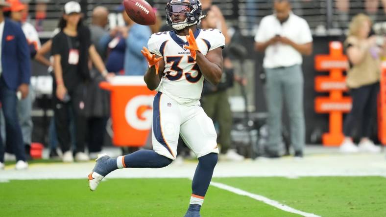 Oct 2, 2022; Paradise, Nevada, USA; Denver Broncos running back Javonte Williams (33) warms up before a game against the Las Vegas Raiders at Allegiant Stadium. Mandatory Credit: Stephen R. Sylvanie-USA TODAY Sports