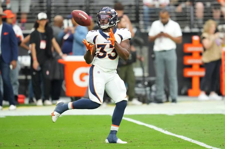 Oct 2, 2022; Paradise, Nevada, USA; Denver Broncos running back Javonte Williams (33) warms up before a game against the Las Vegas Raiders at Allegiant Stadium. Mandatory Credit: Stephen R. Sylvanie-USA TODAY Sports