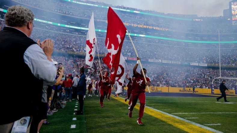 Nov 5, 2022; Baton Rouge, Louisiana, USA; Alabama Crimson Tide cheerleaders lead out the players from the tunnel to start the game against the LSU Tigers before the first half at Tiger Stadium. Mandatory Credit: Stephen Lew-USA TODAY Sports