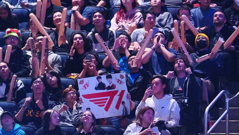 Nov 5, 2022; San Francisco, California, USA;  A fan holds a sign for T1 during the League of Legends World Championships against DRX at Chase Center. Mandatory Credit: Kelley L Cox-USA TODAY Sports