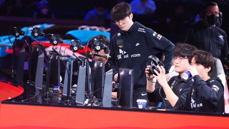 Nov 5, 2022; San Francisco, California, USA; T1 mid laner Lee "Faker" Sang-hyeok sits down to play game 4 against DRX during the League of Legends World Championships at Chase Center. Mandatory Credit: Kelley L Cox-USA TODAY Sports