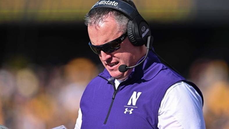 Oct 29, 2022; Iowa City, Iowa, USA; Northwestern Wildcats head coach Pat Fitzgerald looks on during the game against the Iowa Hawkeyes at Kinnick Stadium. Mandatory Credit: Jeffrey Becker-USA TODAY Sports