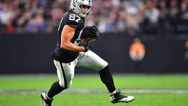 Nov 13, 2022; Paradise, Nevada, USA; Las Vegas Raiders tight end Foster Moreau (87) runs the ball against the Indianapolis Colts during the second half at Allegiant Stadium. Mandatory Credit: Gary A. Vasquez-USA TODAY Sports