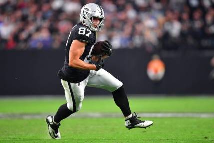 Nov 13, 2022; Paradise, Nevada, USA; Las Vegas Raiders tight end Foster Moreau (87) runs the ball against the Indianapolis Colts during the second half at Allegiant Stadium. Mandatory Credit: Gary A. Vasquez-USA TODAY Sports