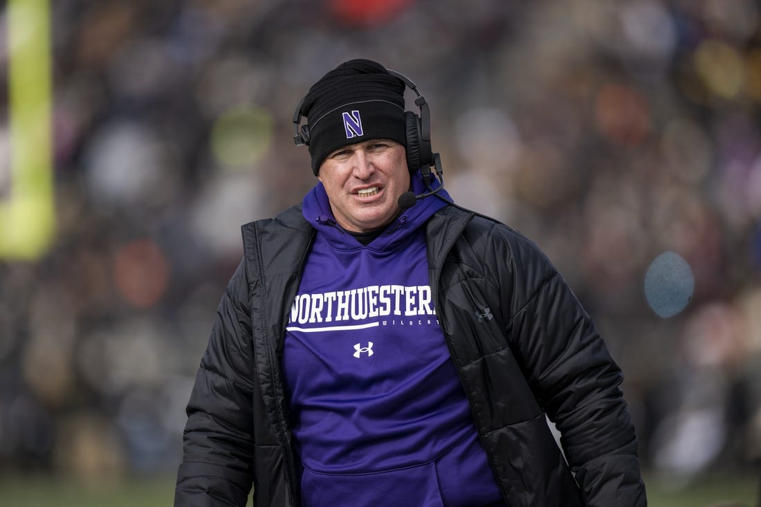 Nov 19, 2022; West Lafayette, Indiana, USA;  Northwestern Wildcats head coach Pat Fitzgerald walks the sidelines during the second quarter against the Purdue Boilermakers at Ross-Ade Stadium. Mandatory Credit: Marc Lebryk-USA TODAY Sports