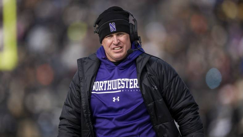 Nov 19, 2022; West Lafayette, Indiana, USA;  Northwestern Wildcats head coach Pat Fitzgerald walks the sidelines during the second quarter against the Purdue Boilermakers at Ross-Ade Stadium. Mandatory Credit: Marc Lebryk-USA TODAY Sports