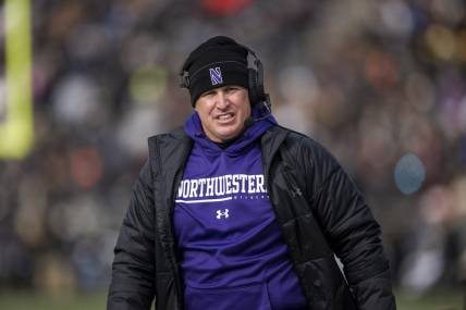 Nov 19, 2022; West Lafayette, Indiana, USA;  Northwestern Wildcats head coach Pat Fitzgerald walks the sidelines during the second quarter against the Purdue Boilermakers at Ross-Ade Stadium. Mandatory Credit: Marc Lebryk-USA TODAY Sports