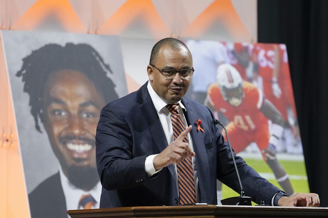 Nov 19, 2022; Charlottesville, Virginia, US; University of Virginia football coach Tony Elliott speaks during a memorial service for three slain University of Virginia football players Lavel Davis Jr., D Sean Perry and Devin Chandler at John Paul Jones Arena at the school in Charlottesville, Va., Saturday, Nov. 19, 2022. Mandatory Credit: Steve Helber/Pool Photo-USA TODAY Sports