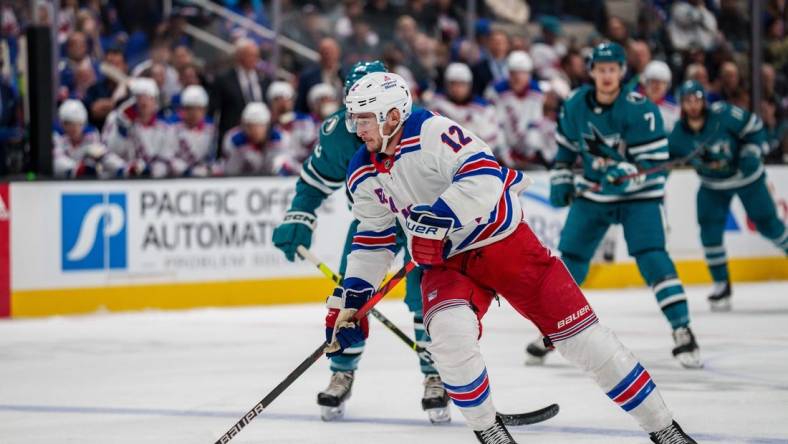 Nov 19, 2022; San Jose, California, USA; New York Rangers right wing Julien Gauthier (12) skates with the puck during the first period against the San Jose Sharks at SAP Center at San Jose. Mandatory Credit: Neville E. Guard-USA TODAY Sports