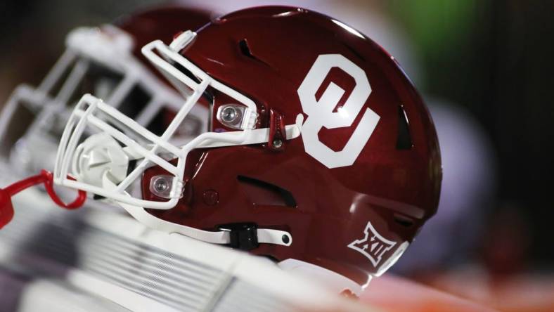 Nov 26, 2022; Lubbock, Texas, USA;  A general view oaf an Oklahoma Sooners helmet on the bench during the game between against the Texas Tech Red Raiders at Jones AT&T Stadium and Cody Campbell Field. Mandatory Credit: Michael C. Johnson-USA TODAY Sports