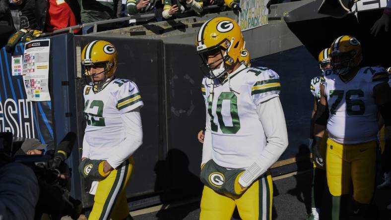 Dec 4, 2022; Chicago, Illinois, USA;  Green Bay Packers quarterback Aaron Rodgers (12) and quarterback Jordan Love (10) during warmups before a game against the Chicago Bears at Soldier Field. Mandatory Credit: Matt Marton-USA TODAY Sports