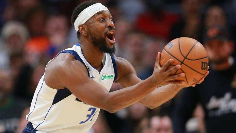 Dec 17, 2022; Cleveland, Ohio, USA; Dallas Mavericks guard Kemba Walker (34) reacts after a foul call during the second half against the Cleveland Cavaliers at Rocket Mortgage FieldHouse. Mandatory Credit: Aaron Josefczyk-USA TODAY Sports