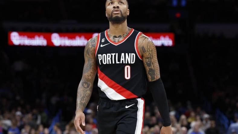 Dec 19, 2022; Oklahoma City, Oklahoma, USA; Portland Trail Blazers guard Damian Lillard (0) looks at the score board during a time out against the Oklahoma City Thunder in the first quarter at Paycom Center. Mandatory Credit: Alonzo Adams-USA TODAY Sports