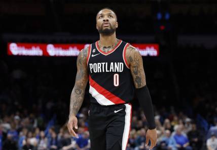 Dec 19, 2022; Oklahoma City, Oklahoma, USA; Portland Trail Blazers guard Damian Lillard (0) looks at the score board during a time out against the Oklahoma City Thunder in the first quarter at Paycom Center. Mandatory Credit: Alonzo Adams-USA TODAY Sports