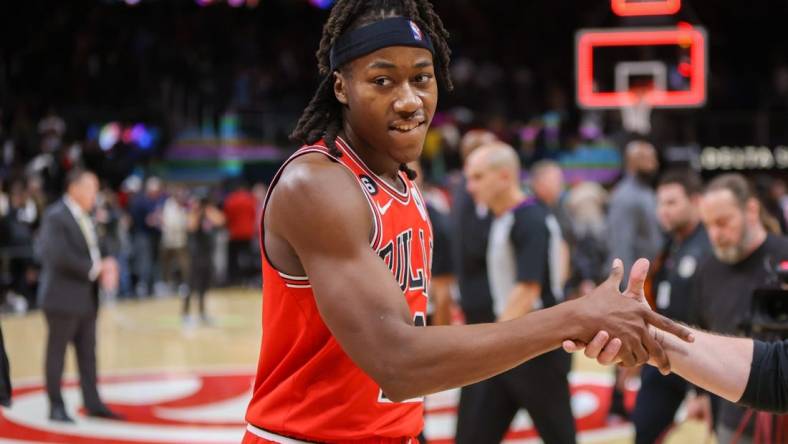 Dec 21, 2022; Atlanta, Georgia, USA; Chicago Bulls guard Ayo Dosunmu (12) celebrates after a game-winning basket against the Atlanta Hawks at State Farm Arena. Mandatory Credit: Brett Davis-USA TODAY Sports