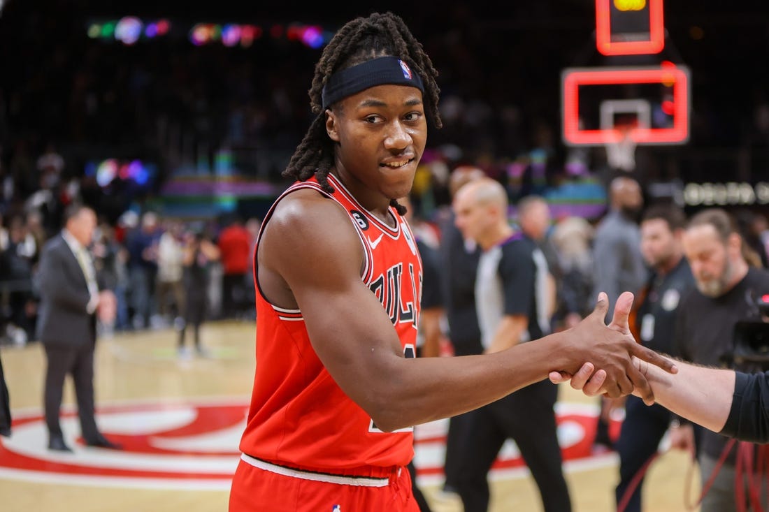 Dec 21, 2022; Atlanta, Georgia, USA; Chicago Bulls guard Ayo Dosunmu (12) celebrates after a game-winning basket against the Atlanta Hawks at State Farm Arena. Mandatory Credit: Brett Davis-USA TODAY Sports