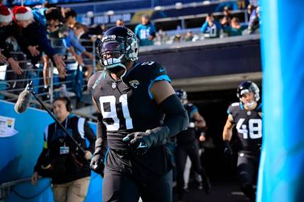 Jacksonville Jaguars defensive end Dawuane Smoot (91) takes to the field before a regular season NFL football matchup between the Jacksonville Jaguars and the Dallas Cowboys Sunday, Dec. 18, 2022 at TIAA Bank Field in Jacksonville. The Jacksonville Jaguars edged the Dallas Cowboys 40-34 in overtime. [Corey Perrine/Florida Times-Union]

Jki 121822 Cowboys Jags Cp 101