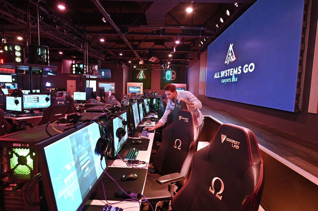 WORCESTER - Devin LaPlume sets up computers in front of a stage and big screen monitor at All Systems Go Esports Bar which is now All Systems Go Esports Facility and is working to grow the esports scene in local colleges and high schools.

Loc Asgexpansion5 0105