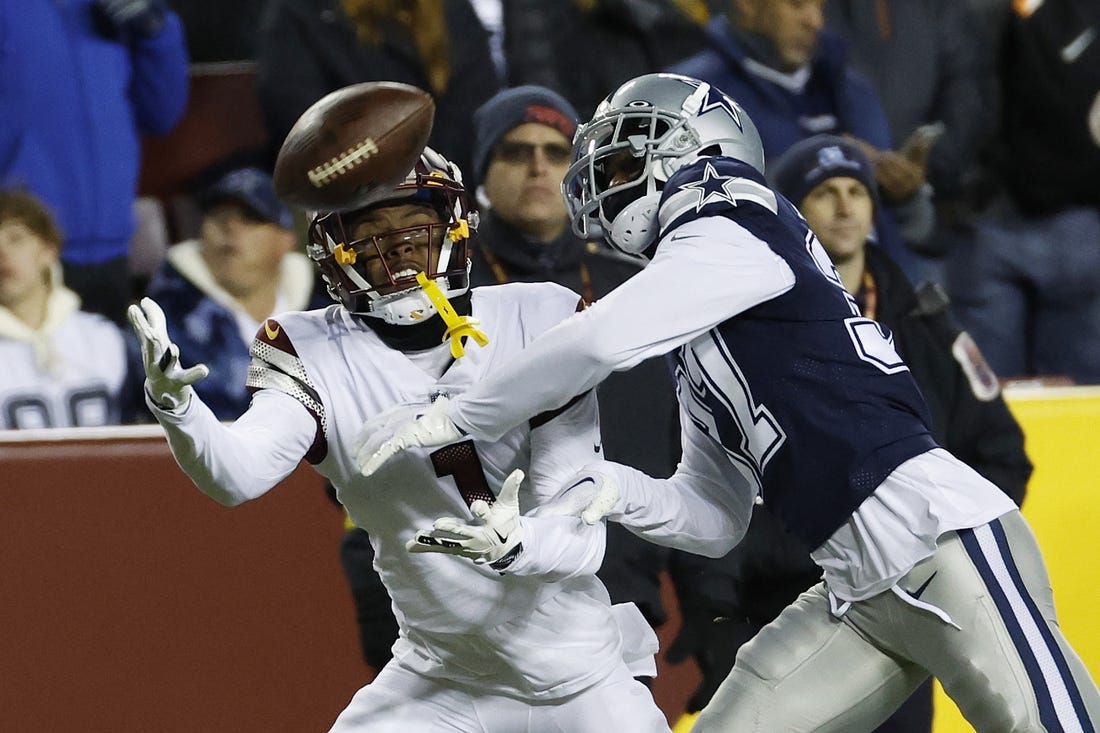 Jan 8, 2023; Landover, Maryland, USA; Washington Commanders wide receiver Jahan Dotson (1) attempts to catch a pass as Dallas Cowboys cornerback Trayvon Mullen (37) defends during the third quarter at FedExField. Mandatory Credit: Geoff Burke-USA TODAY Sports