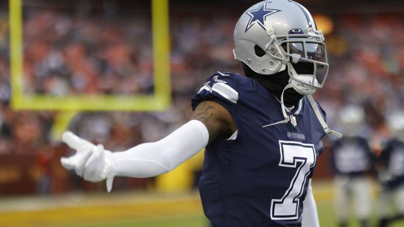 Jan 8, 2023; Landover, Maryland, USA; Dallas Cowboys cornerback Trevon Diggs (7) gestures on the field during warmups prior to the Cowboys' game against the Washington Commanders at FedExField. Mandatory Credit: Geoff Burke-USA TODAY Sports