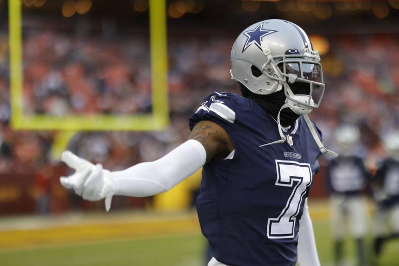 Jan 8, 2023; Landover, Maryland, USA; Dallas Cowboys cornerback Trevon Diggs (7) gestures on the field during warmups prior to the Cowboys' game against the Washington Commanders at FedExField. Mandatory Credit: Geoff Burke-USA TODAY Sports