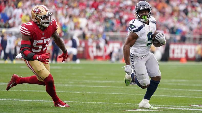 Jan 14, 2023; Santa Clara, California, USA; Seattle Seahawks running back Kenneth Walker III (9) runs away from San Francisco 49ers linebacker Dre Greenlaw (57) for a second quarter touchdown run during a wild card game at Levi's Stadium. Mandatory Credit: Cary Edmondson-USA TODAY Sports