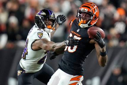 Cincinnati Bengals wide receiver Tee Higgins (85) is unable to hold onto a pass under pressure from Baltimore Ravens cornerback Marcus Peters (24) in the third quarter during an NFL wild-card playoff football game between the Baltimore Ravens and the Cincinnati Bengals, Sunday, Jan. 15, 2023, at Paycor Stadium in Cincinnati. The Bengals advanced to the Divisional round of the playoffs with a 24-17 win over the Ravens.

Baltimore Ravens At Cincinnati Bengals Afc Wild Card Jan 15 302

Syndication The Enquirer