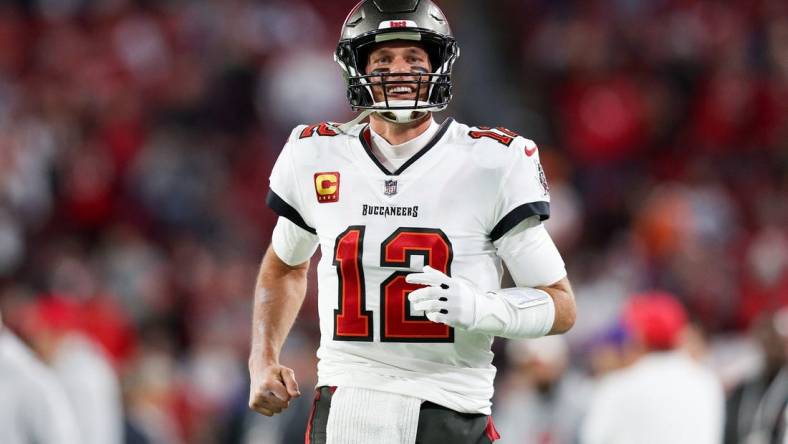 Jan 16, 2023; Tampa, Florida, USA; Tampa Bay Buccaneers quarterback Tom Brady (12) takes the field before a wild card game against the Dallas Cowboys at Raymond James Stadium. Mandatory Credit: Nathan Ray Seebeck-USA TODAY Sports