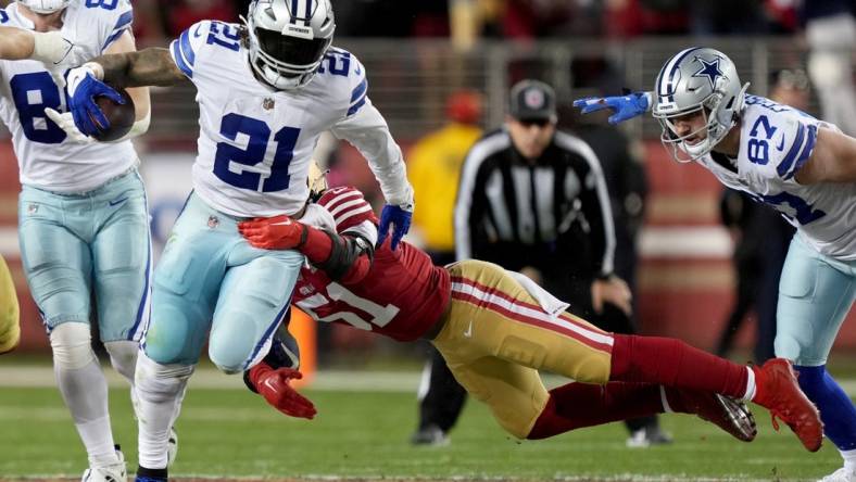 Jan 22, 2023; Santa Clara, California, USA; Dallas Cowboys running back Ezekiel Elliott (21) runs past San Francisco 49ers linebacker Azeez Al-Shaair (51) during the fourth quarter of a NFC divisional round game at Levi's Stadium. Mandatory Credit: Kyle Terada-USA TODAY Sports